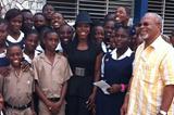 Veronica Campbell Brown (centre in hat) surrounded by students at St Andrew Technical while on a visit to Kingston in January 2012