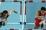 Andrew Pozzi of Great Britain and Lui Xiang of China compete in the Men's 60 Metres Hurdles first round during day two - WIC Istanbul (Getty Images)