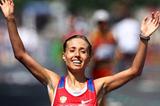 Gold medalist Olga Kaniskina of Russia celebrates as she crosses the finish line during the women's 20km race walk during day five  (Getty Images)