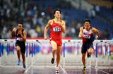 Liu Xiang beats the driving rain to take the Asian title (Jiro Mochizuki)