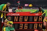 Winning Jamaican team: Usain Bolt, Yohan Blake, Michael Frater and Nesta Carter next to the clock showing the new world record of 36.84 in the Men's 4 x 100m Relay Final of the London 2012 Olympic Games on August 11, 2012  (Getty Images)