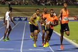Yohan Blake (yellow vest) collects the baton behind Edino Steele at the 2013 Gibson Relays  (Anthony Foster)