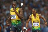 Usain Bolt of Jamaica celebrates in front of teammate Warren Weir of Jamaica after winning gold in the Men's 200m Final of the London 2012 Olympic Games on 9 August 2012 (Getty Images)