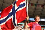 Andreas Thorkildsen flys the flag for Norway after winning the men's Javelin Throw at the 12th IAAF World Championships in Athletics in the Berlin Olympic Stadium (Getty Images)