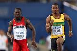 Justyn Warner (L) of Canada and Yohan Blake of Jamaica compete in the men's 100 metres heats during day one  (Getty Images)