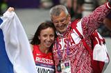 Gold medalist Mariya Savinova of Russia celebrates with her coach Vladimir Kazarin after winning gold in the Women's 800m Final  of the London 2012 Olympic Games