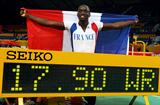 Teddy Tamgho of France with World indoor record scoreboard in Doha (Getty Images)