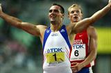 Sebrle crosses the finish of the 1500m to win the Decathlon (Getty Images)