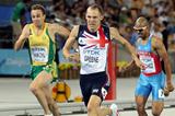 David Greene (C) of Great Britain celebrates after crossing the finish line and claiming gold ahead of L.J. van Zyl (L) of South Africa and Felix Sanchez of Dominican Republic in the men's 400 metres hurdles final 