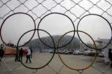 Under construction - The Olympic Rings are put into a metal gate at a viewing site of the National Stadium, 11 October 2007 in Beijing, The venue will host the opening and closing ceremonies and athletics events (AFP / Getty Images)
