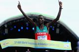 Abel Kirui of Kenya crosses the Marathon finish line to win the gold medal and set a Championship Record of 2:06:54 at the IAAF World Championships in Berlin (Getty Images)