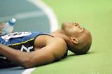 Frank Fredericks resting after victory (© Allsport)